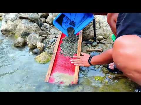 Gold Panning Using a Sluice Box Digging Beneath River Rocks