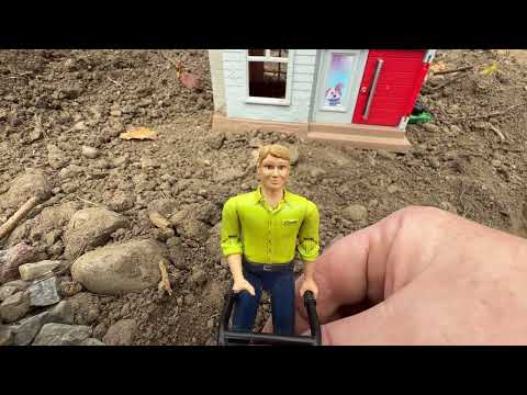 Driving skid steer to move dirt and regrade backyard
