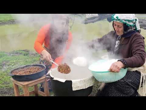 See the women in the village cooking with rice and
