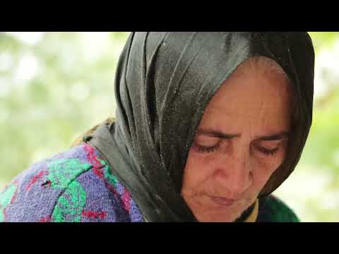 Grandma cooks a big hamburger in the village Homemade fast