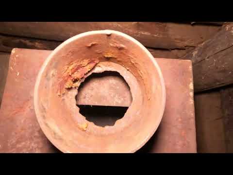 A secret house in the forest bushcraft wood burning stove