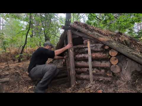 My first dugout in the forest cooking on the stove rain