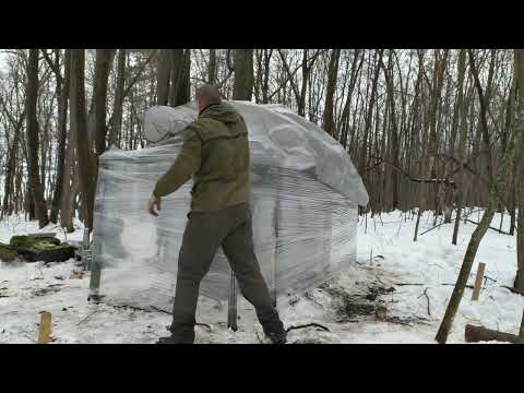 Shelter in the woods overnight alone in bushcraft shelter