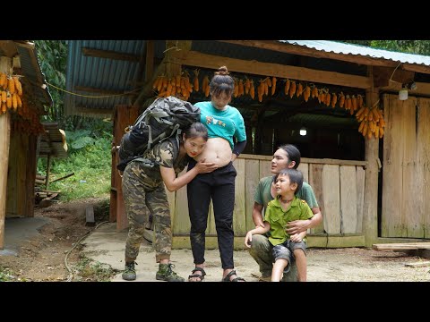 Visiting pregnant sister weaving basket for her to hold