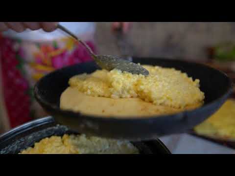 MARI GRANDMOTHER prepares cereal PANCAKES in RUSSIAN stove