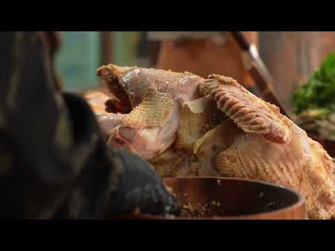 Village Turkey Roasted Under Metal Buckets Over Fire